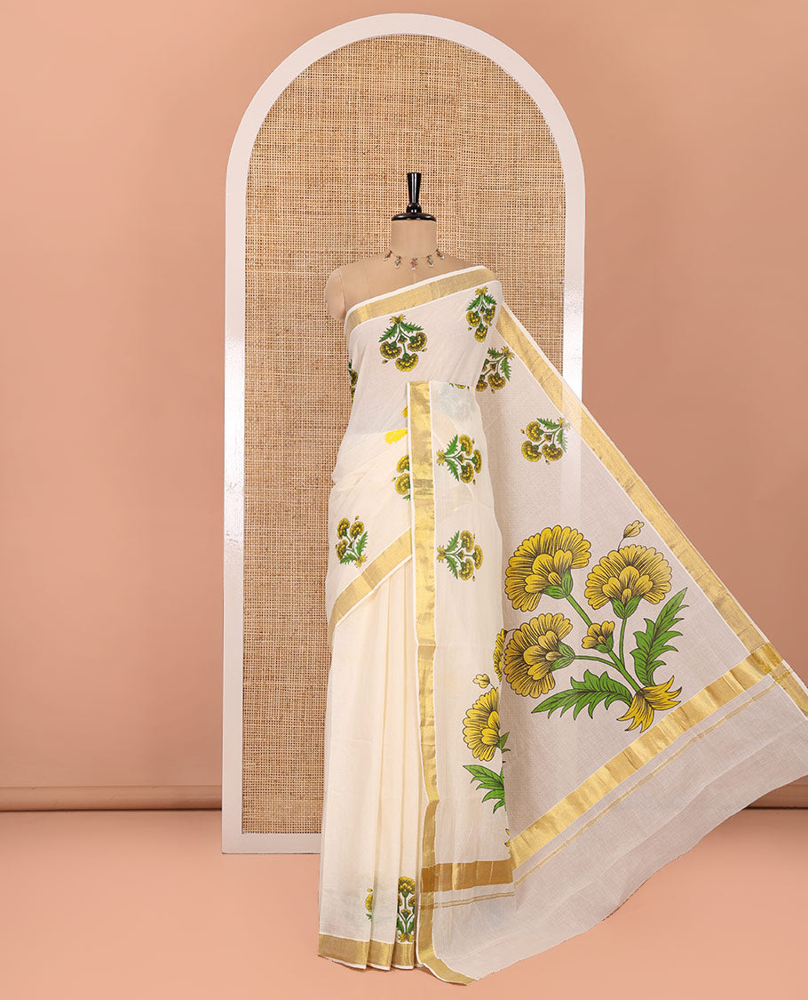 Cream and Yellow Kerala Cotton Saree, Detailed with Bunch of Floral Motifs Printed on Its Body, Subtle Zari Border, Pallu Features a Big Bunch of Floral Motifs Print, and Paired with a Matching Blouse