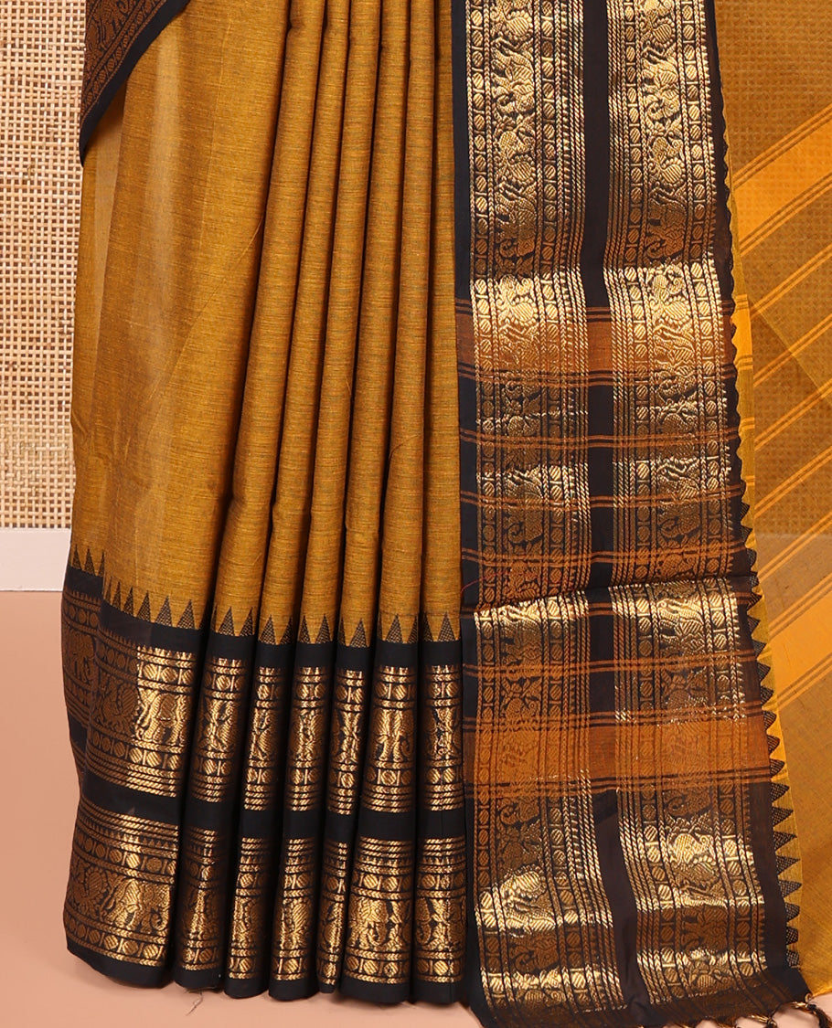 Mustard Plain Chettinad Cotton Saree, Complemented by a Contrast Rettai Pettu Zari Border of Thread-Temple, Coin, Elephant, and Peacock Designs, Subtly Striped Pallu, and Paired with a Matching Blouse