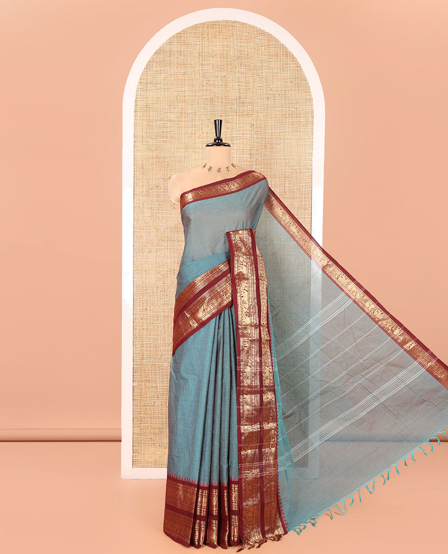 Teal Plain Chettinad Cotton Saree, Complemented by a Contrast Traditional Zari Design Rettai Pettu Border of Peacock and Elephant Designs, Pallu of Stripes, and Paired with a Matching Blouse