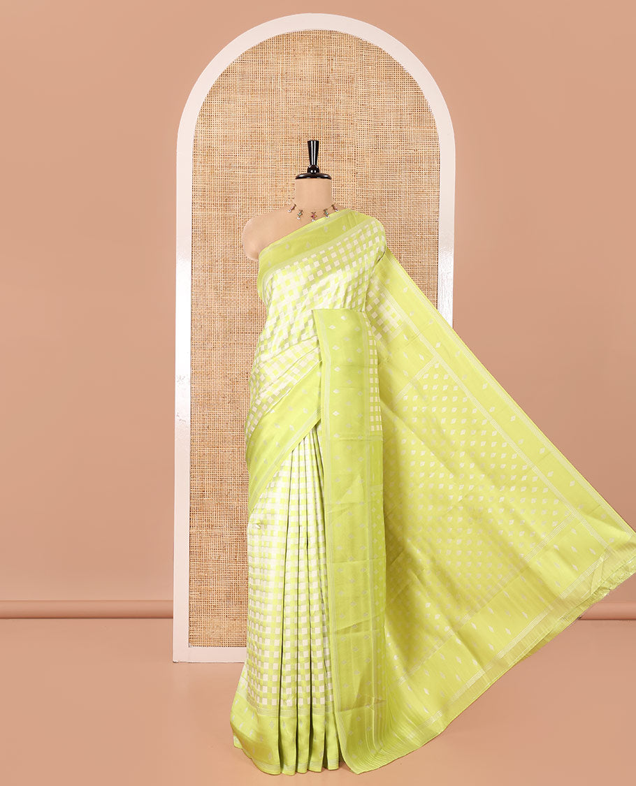 Green Kanchi Silk Saree, Accentuated with Checked Design on Its Body, Highlighted by a Self-Border of Diamond Patterns, Pallu Steeped with Buttas, and Paired with a Matching Blouse