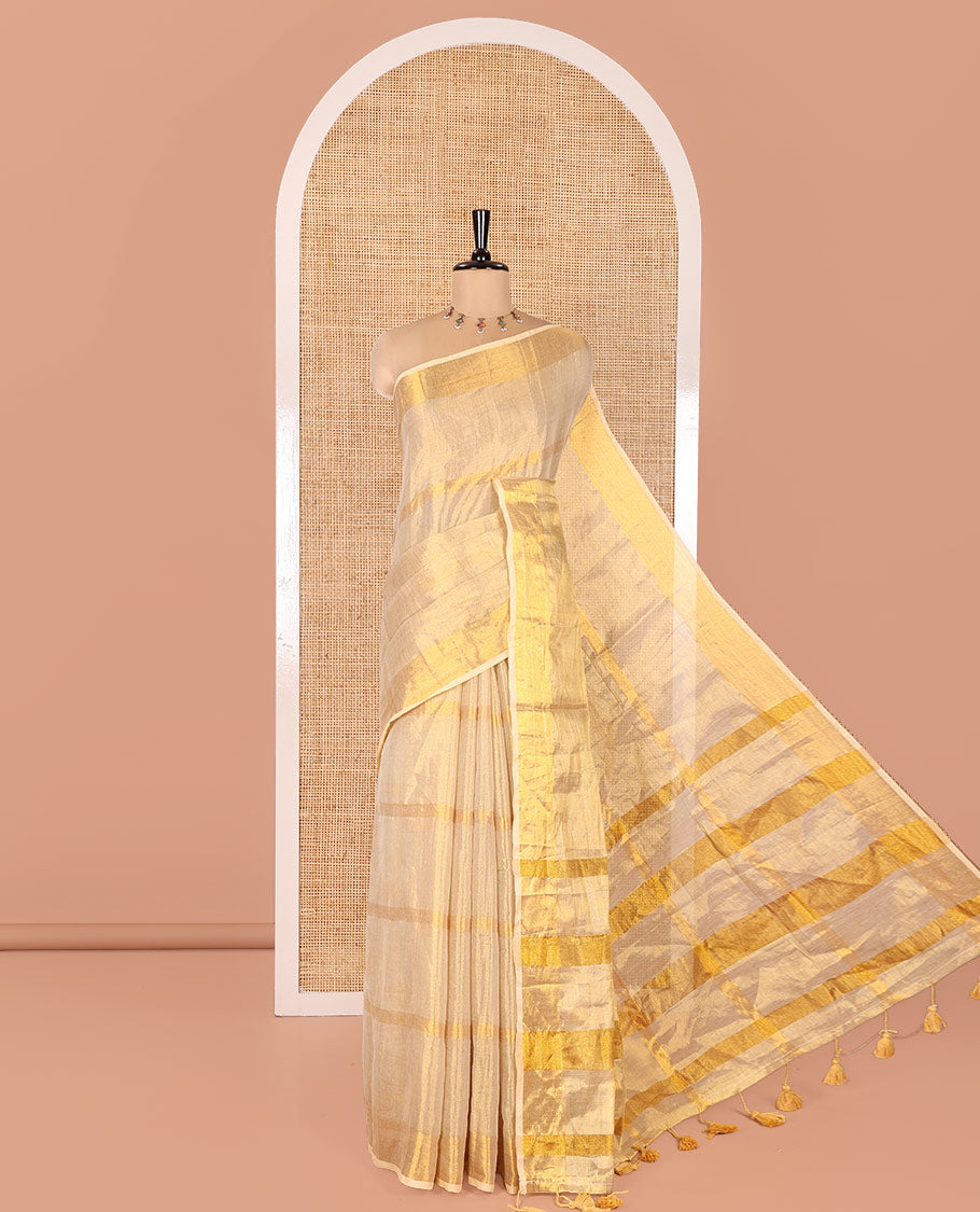 Gleaming Gold Khadi Tissue Saree, Elevated with Zari Stripes All Over Its Body, Highlighted by Zari Bavanji Border, Zari Striped Pallu, and Paired with a Matching Blouse