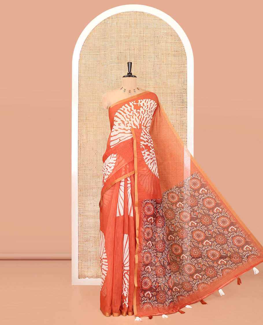 Rust Linen Cotton Saree, Elevated with Floral Motifs Printed on Its Body, Subtle Piping Border, Complemented by a Contrast Floral Printed Blouse, and Paired with a Contrast Blouse