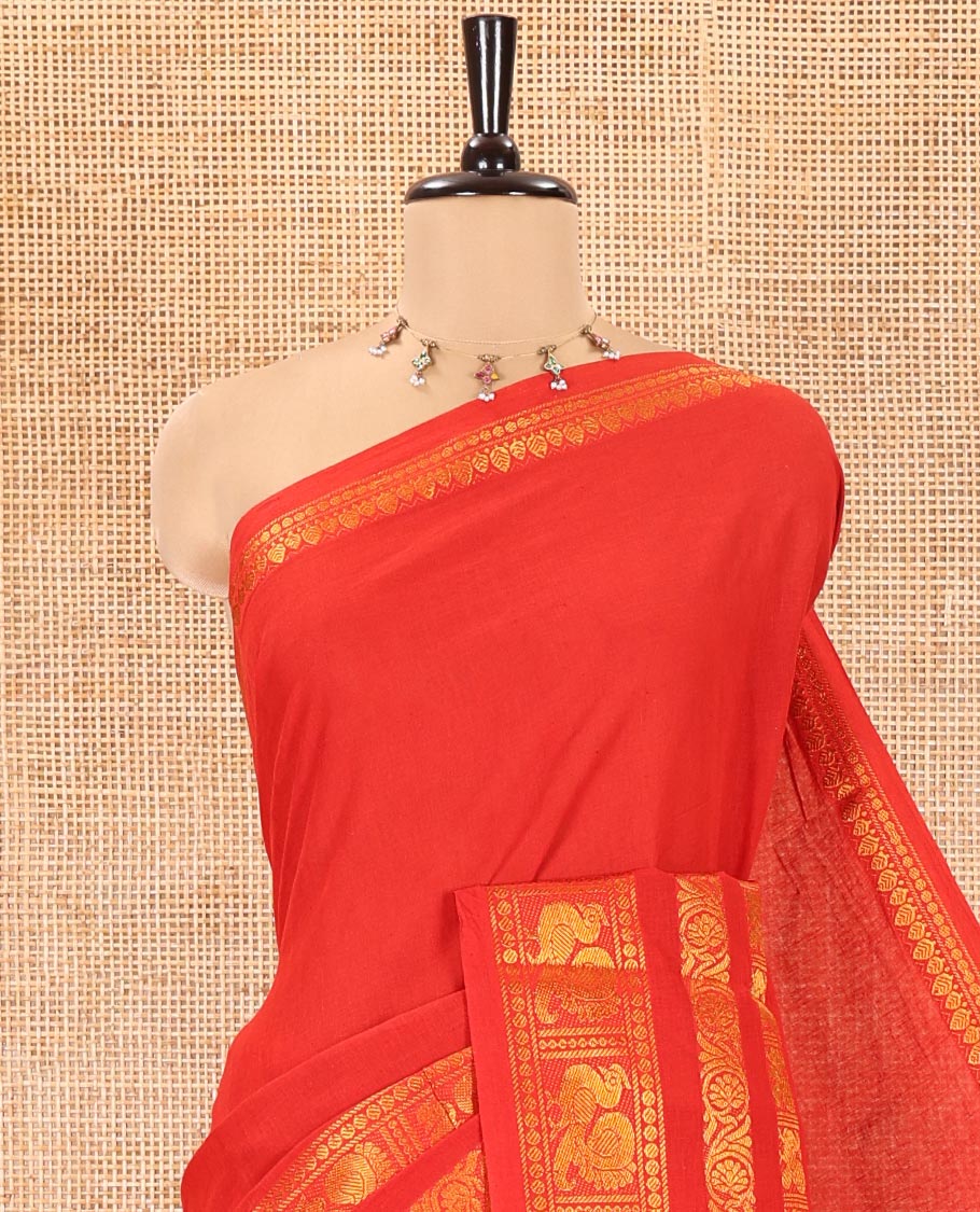 Orange Plain Sungudi Cotton Saree, Highlighted by Traditional Zari Border of Peacock and Floral Creeper Designs, Subtly Striped Pallu, and Paired with a Contrast Blouse