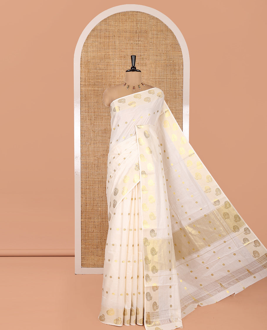 Cream Kerala Cotton Saree, Spotlighted with Zari Buttas, Highlighted by Zari Border, Intricate Pallu, and a Matching Blouse