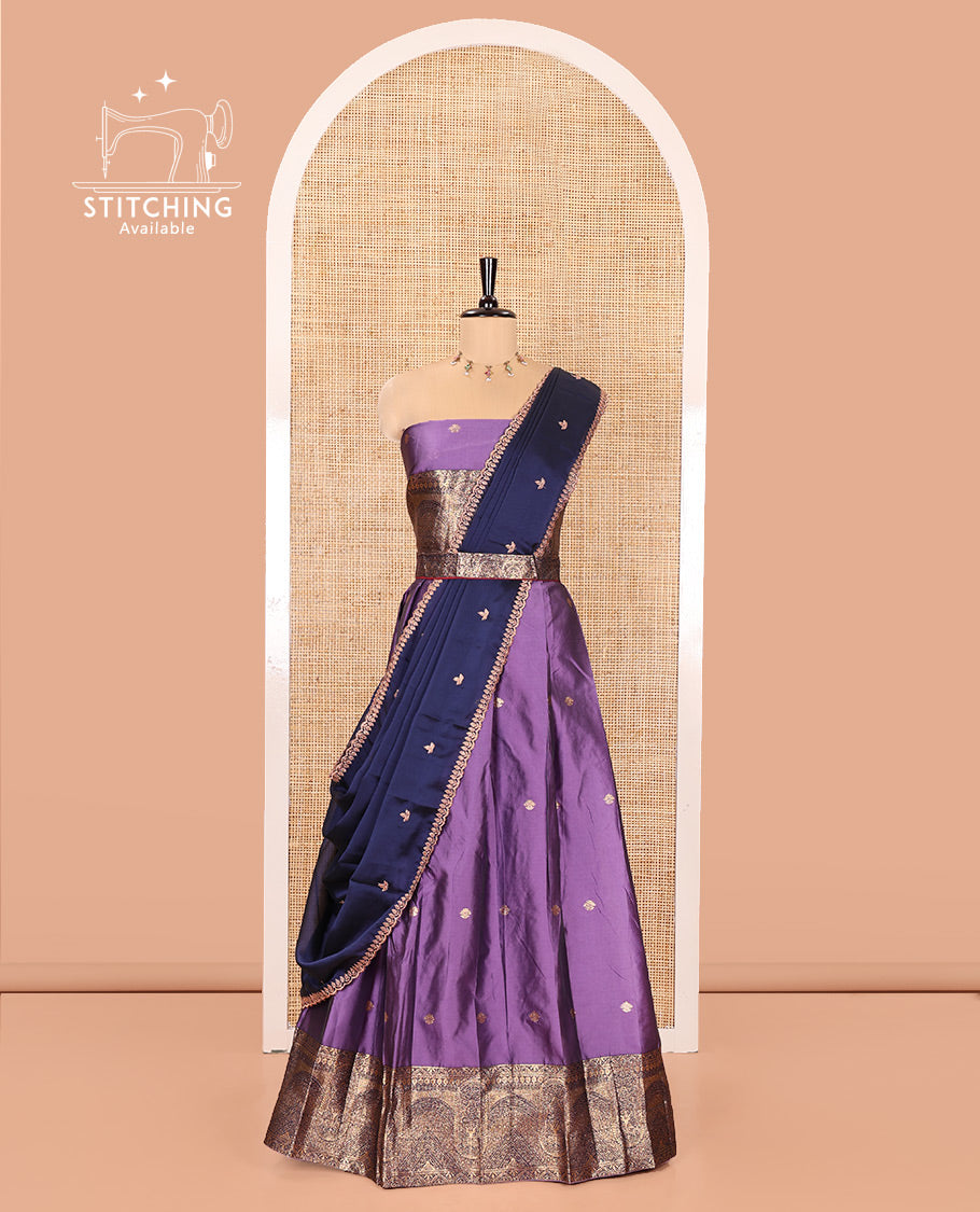 Violet and Blue Semi-Banarasi Half-Saree, Delicately Detailed with Zari Buttas on Its Skirt, Complemented by a Contrast Geometric Patterns Zari Woven Border, Paired with a Matching Blouse, and a Contrast Satin Georgette Embroidered Scallop Dhavani