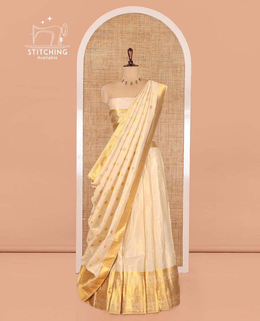 Cream Semi-Banarasi Tissue Half-Saree Features a Plain Skirt, a Traditional Border, Matching Blouse, and Intricate Dhavani