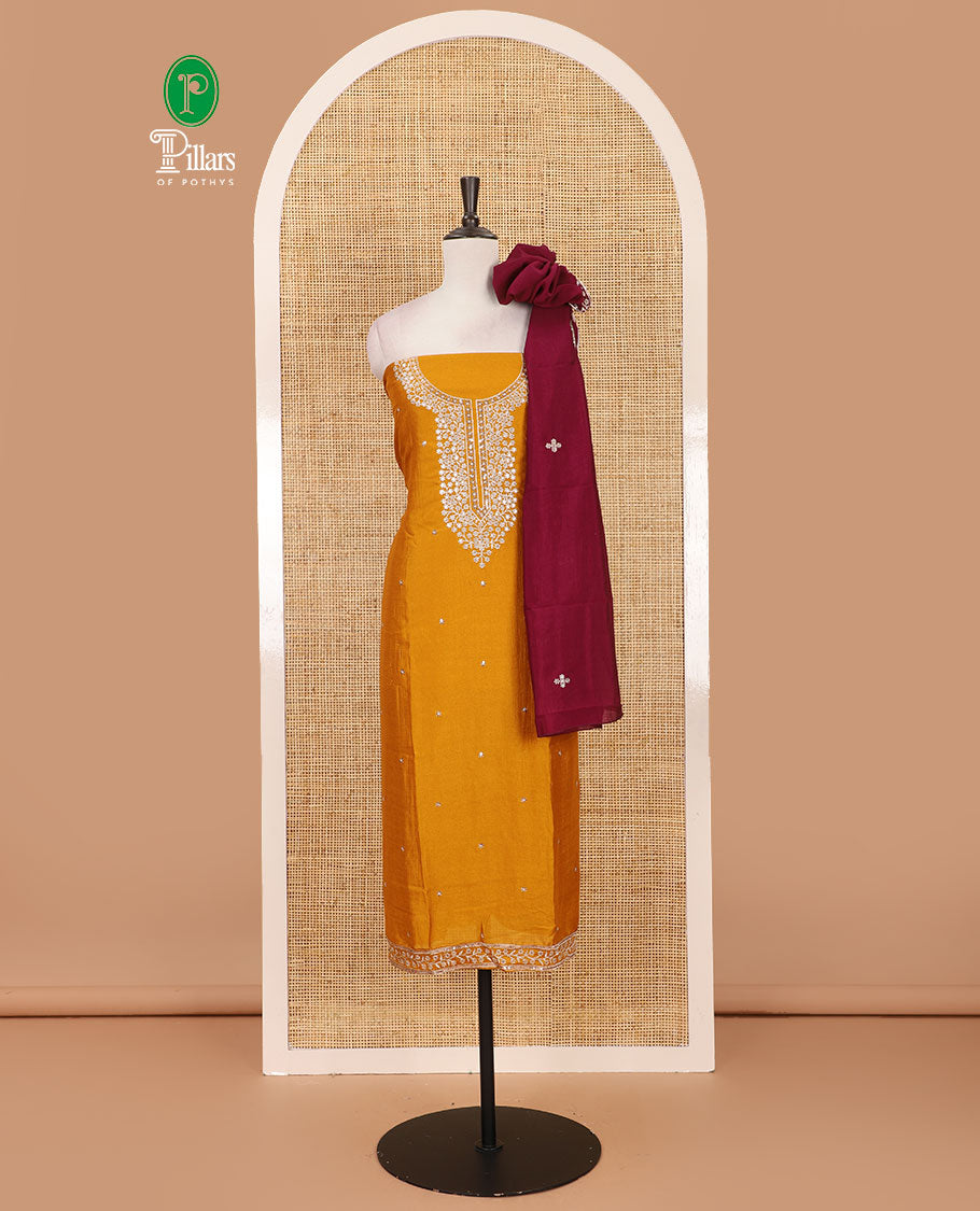 Cream-light purple material chudidar set, floral print and thread woven top, contrast plain bottom, and floral printed dupatta