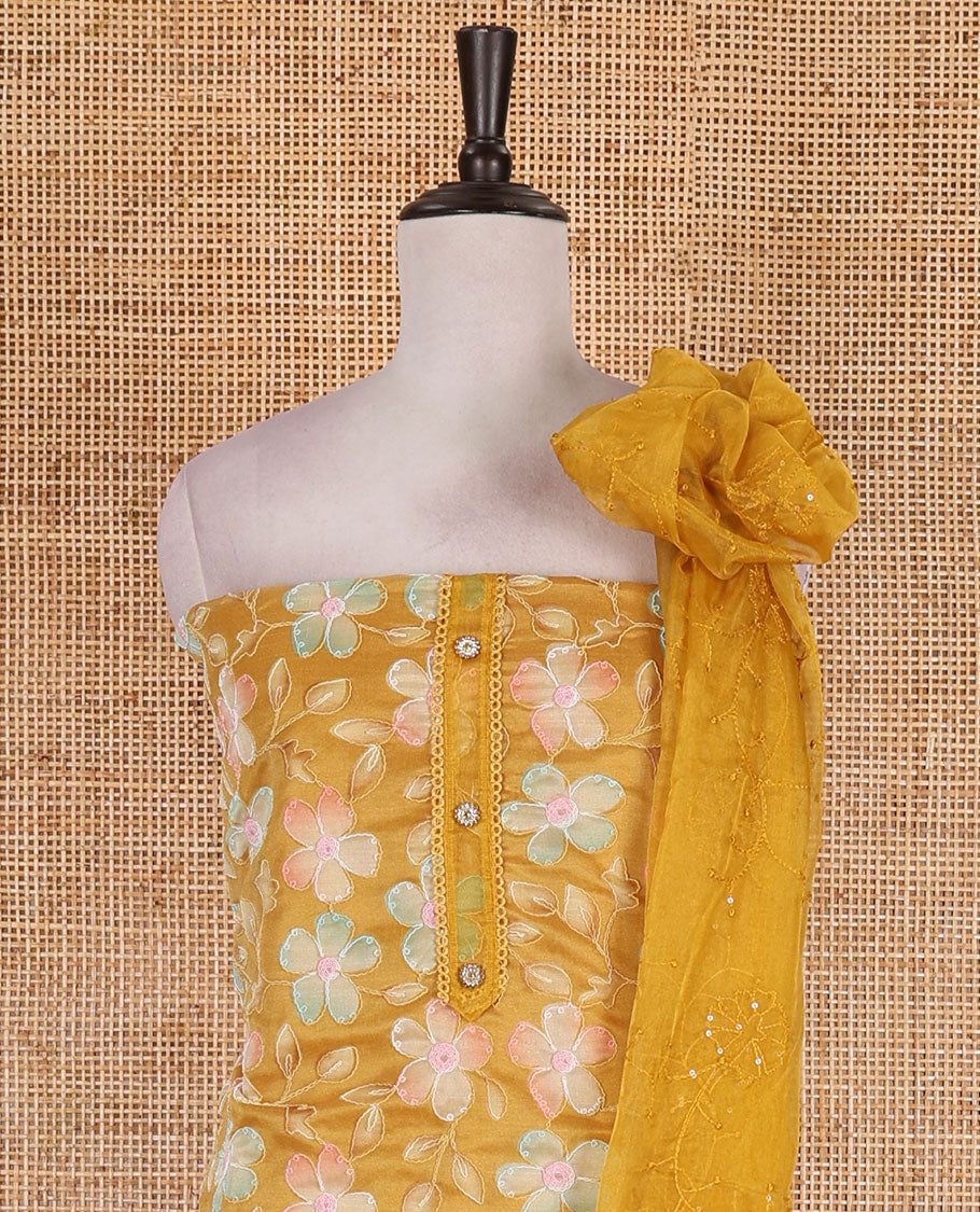 Mustard churidar material set, floral print with thread outlined organza top, plain santoon bottom, and floral vine sequins embroidered organza dupatta