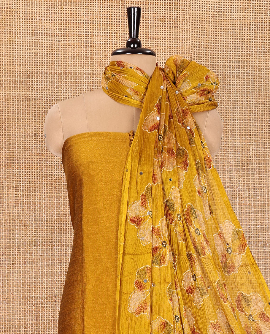 Yellow Material Churidar Set, Subtly Designed with Plain Vichitra Silk Top, Comes with a Plain Santoon Bottom, and Is Paired with a Crushed Chiffon Dupatta of Floral Print and Mirror Work