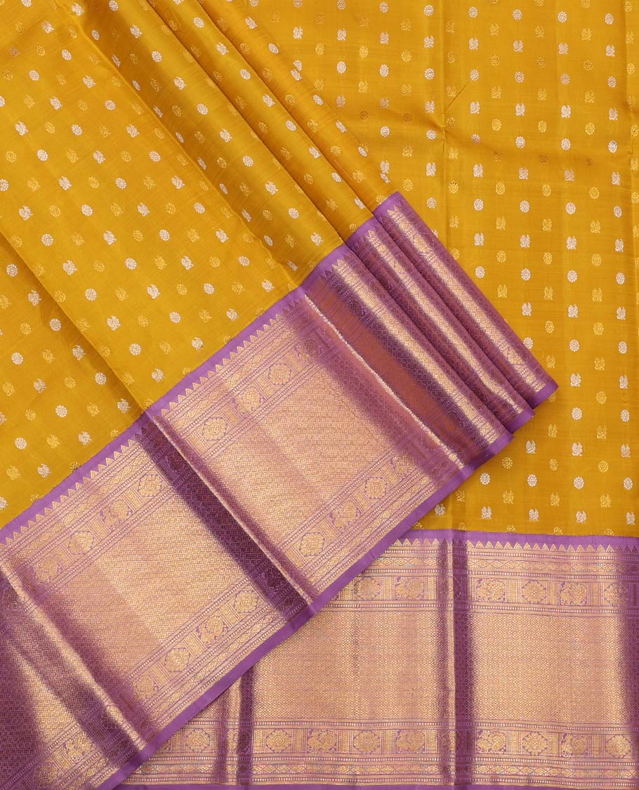 Yellow Pure Silk Half-Saree, Artfully Detailed with Mayil-Chakram Buttas on Its Skirt, Complemented by a Contrast Border of Rekku, Muthu, Diamond, Chakram, and Jaal Designs, Comes with a Contrast Blouse and a Dhavani of Jacquard Design