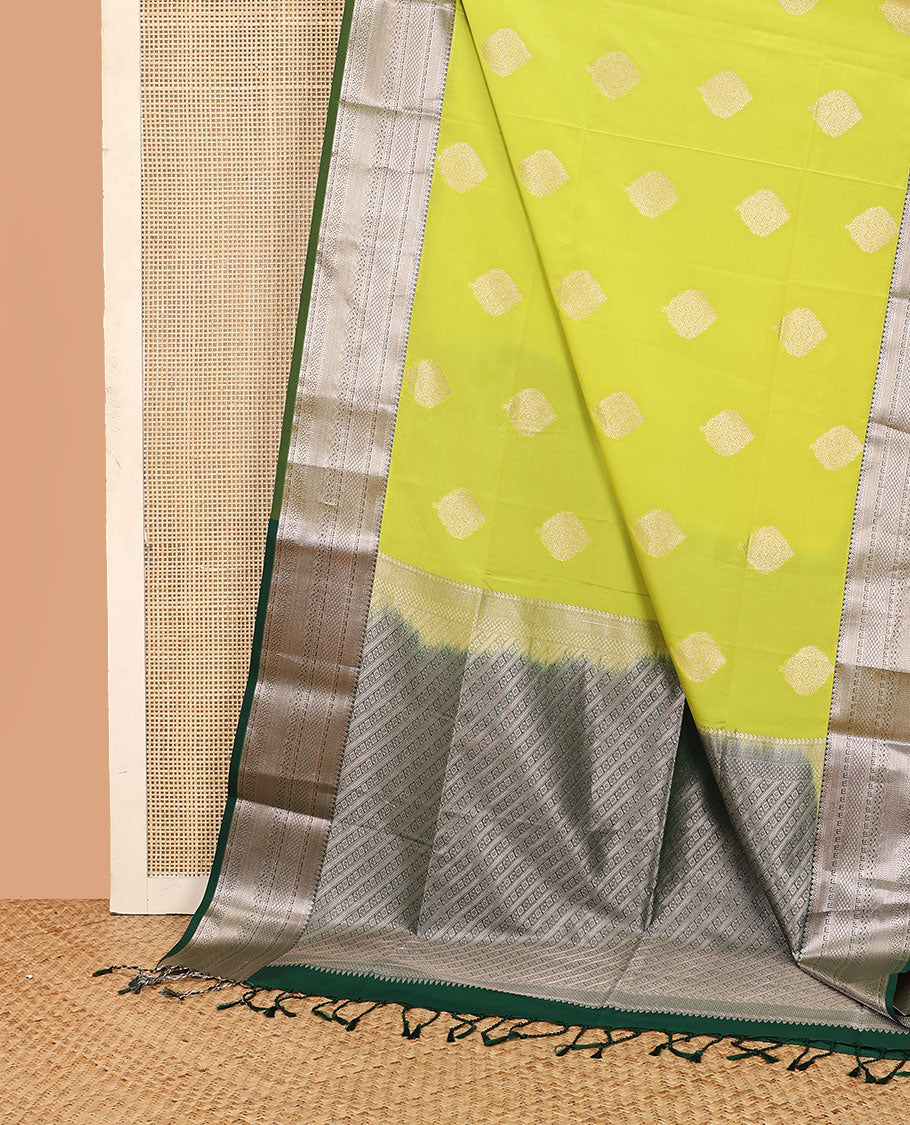 Yellow zari buttas soft silk saree, contrast traditional zari design border, and intricate pallu