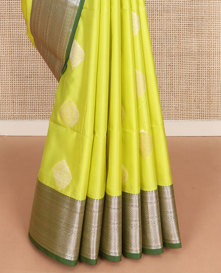 Yellow zari buttas soft silk saree, contrast traditional zari design border, and intricate pallu