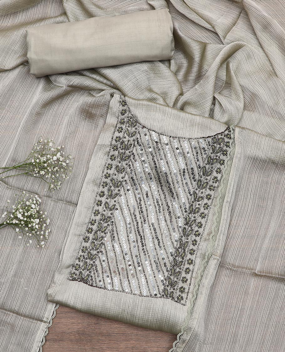 Pale green material chudidar set, neck embroidered top, plain bottom, and plain scallop border dupatta