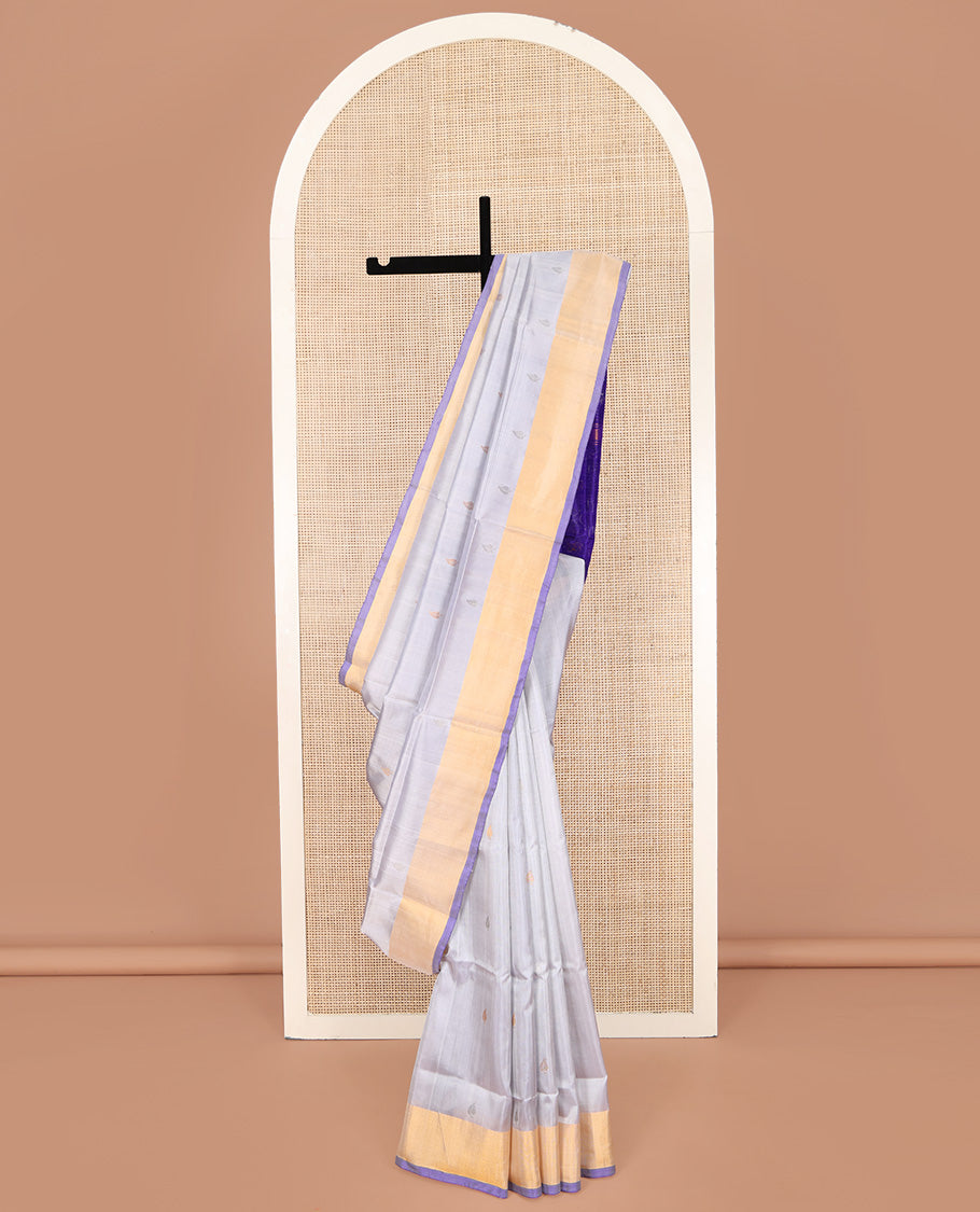 Grey Uppada Silk Saree, Sparsely Woven with Buttas All Over Its Body, Subtle Bavanji Border, Complemented by Contrast Pallu of Butta Enclosed Jaal Designs, and Paired with a Contrast Blouse