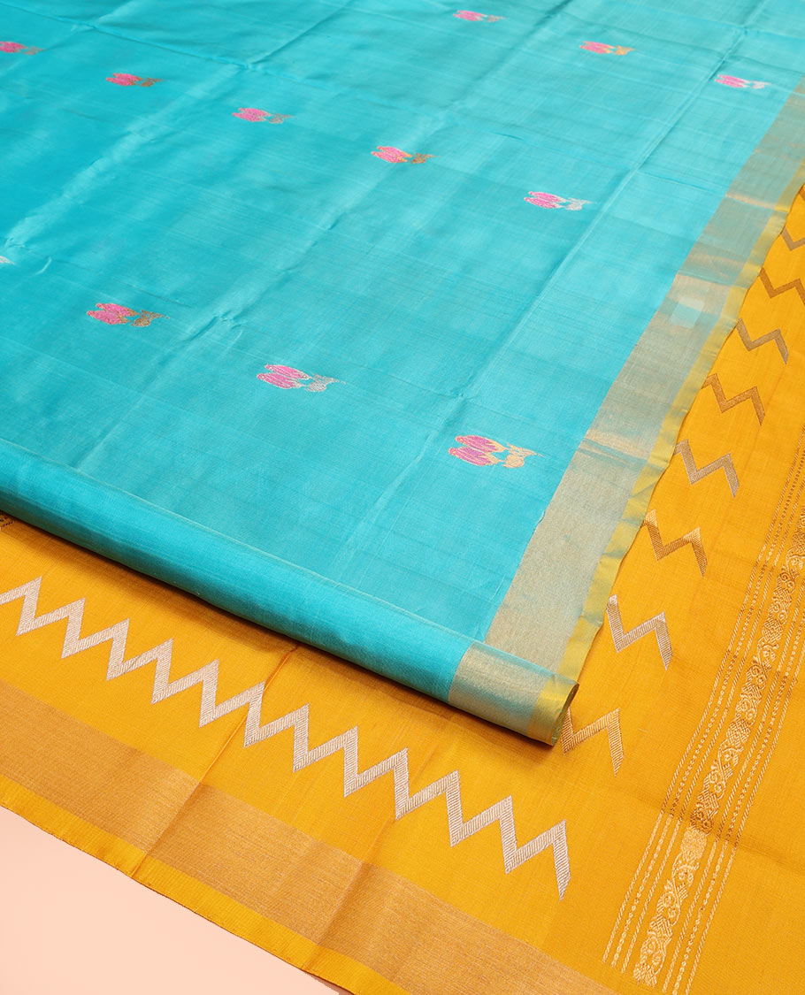 Sky Blue Uppada Silk Saree Elegantly Framed with Meena Floral Buttas, Complemented by a Contrast Bavanji Border, Pallu Steeped with Floral-Paisley Designs, and Paired with a Contrast Blouse