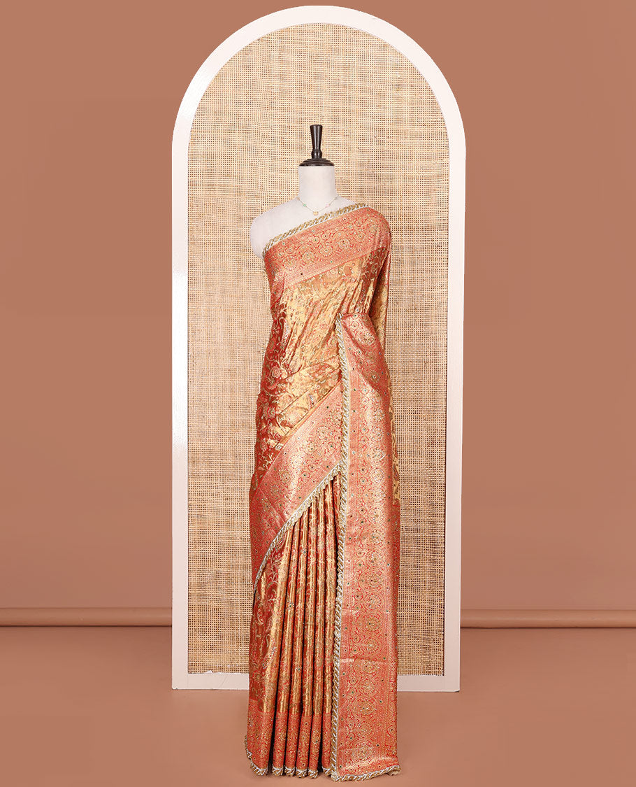 Gold Vastrakala Silk Saree, Decorated with Floral Jaal and Stone Work, Complemented by Contrast Traditional Zari and Stone Embroidered Scallop Border, Gleaming Grand Zari-Stone Work Pallu, and Paired with Contrast Heavy Stone Embroidered Blouse