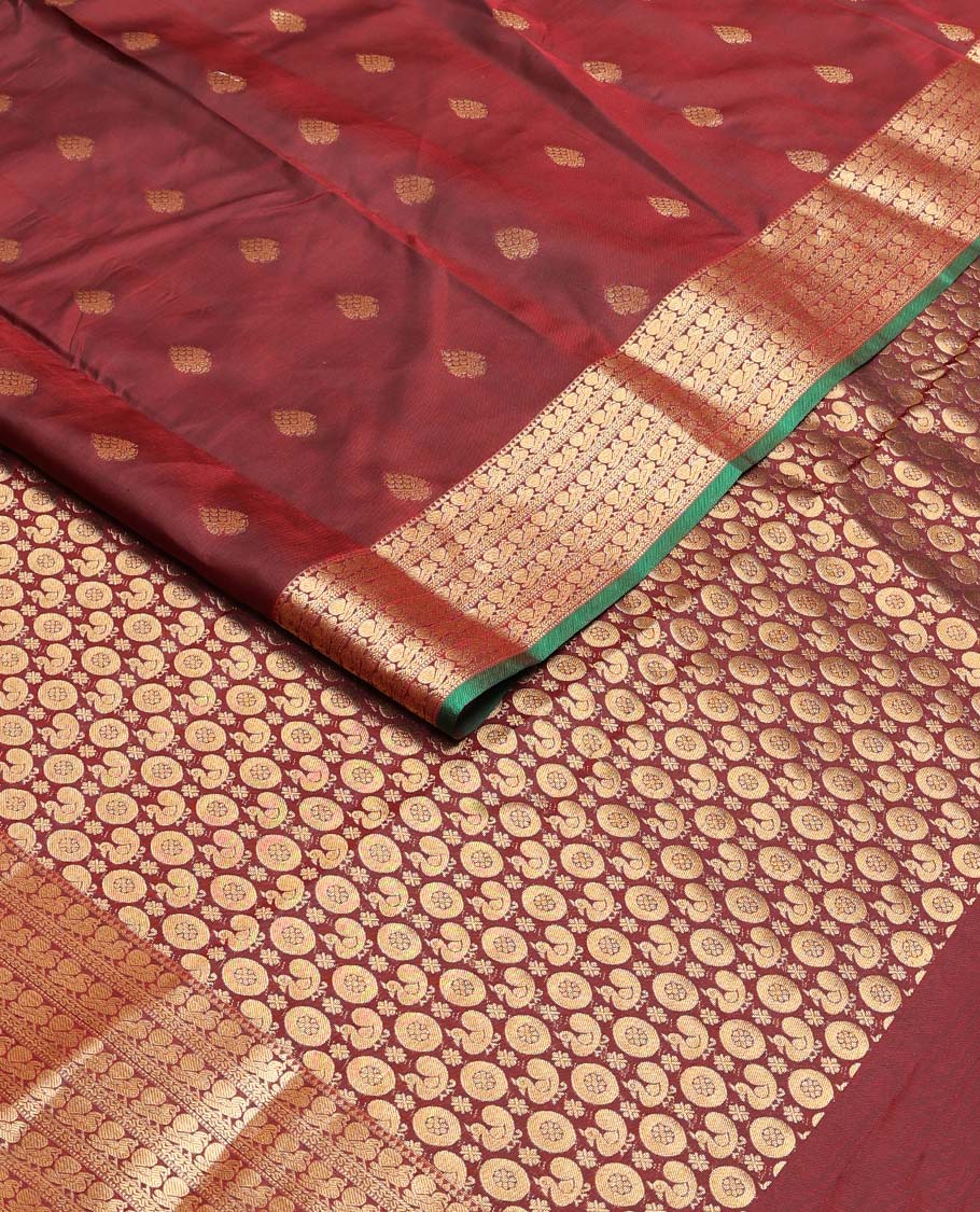 Maroon zari buttas Vasundhara silk mix saree, zari border of rekku & mayil designs & pallu steeped with mayil chakram designs