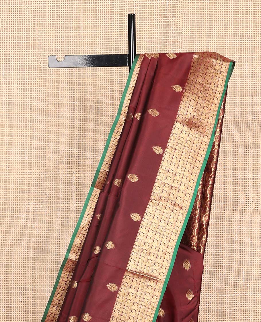 Maroon zari buttas Vasundhara silk mix saree, zari border of rekku & mayil designs & pallu steeped with mayil chakram designs
