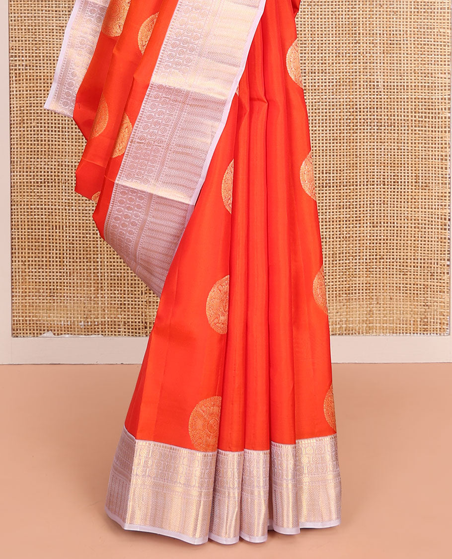Orange Vasundhara Lite-Silk Mix Saree, Embellished with Chakram Zari Buttas All Over Its Body, Complemented by a Contrast Border of Rekku, Rudraksham, Neli, and Kathir Designs, Artfully Decked Up Pallu of Kathir Designs, and Paired with a Contrast Blouse