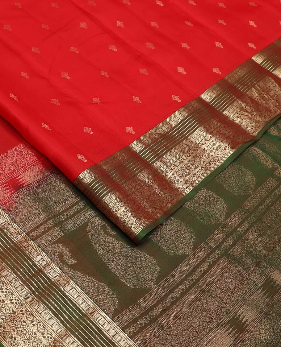 Red zari buttas Vasundhara silk mix saree, contrast border of muthu, banaras, kodi visiry, and chakram designs, and pallu of manga designs