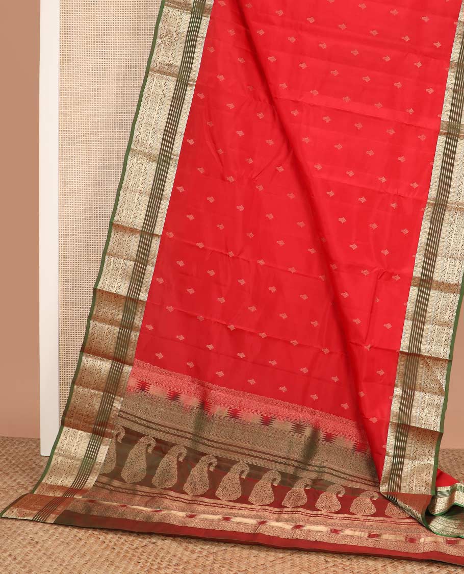 Red zari buttas Vasundhara silk mix saree, contrast border of muthu, banaras, kodi visiry, and chakram designs, and pallu of manga designs