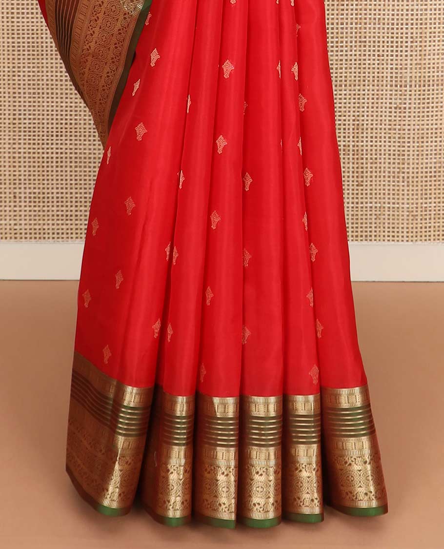 Red zari buttas Vasundhara silk mix saree, contrast border of muthu, banaras, kodi visiry, and chakram designs, and pallu of manga designs