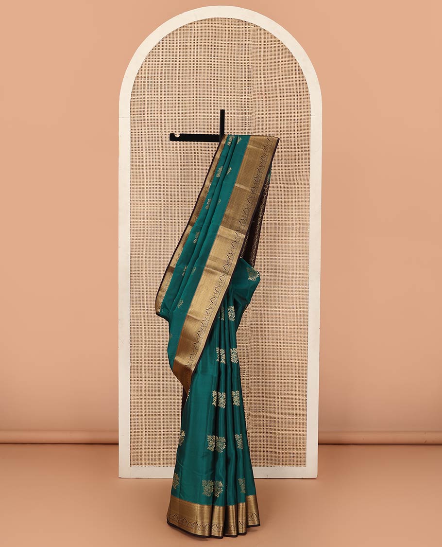 Green zari buttas Vasundhara silk mix saree, contrast border of rekku, muthu, poun, vanki, and zari designs, and leaf vine design pallu