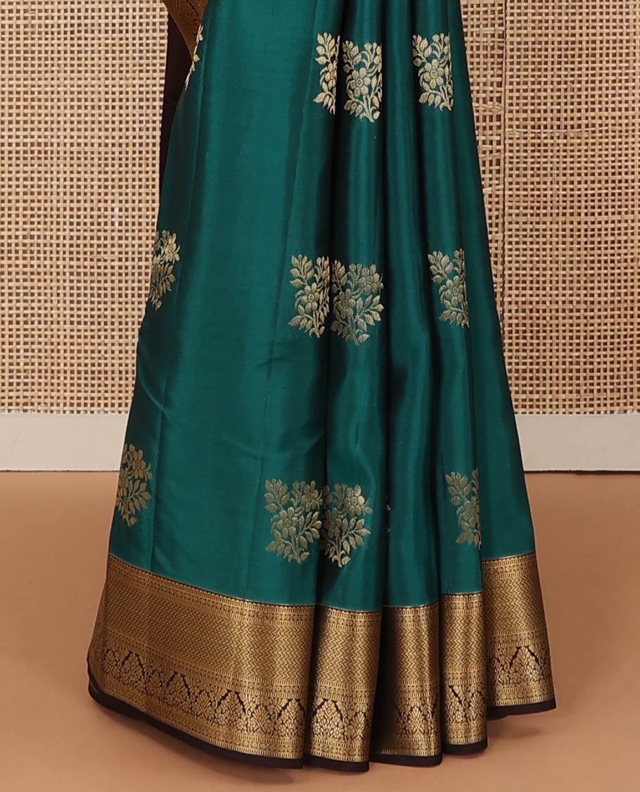 Green zari buttas Vasundhara silk mix saree, contrast border of rekku, muthu, poun, vanki, and zari designs, and leaf vine design pallu