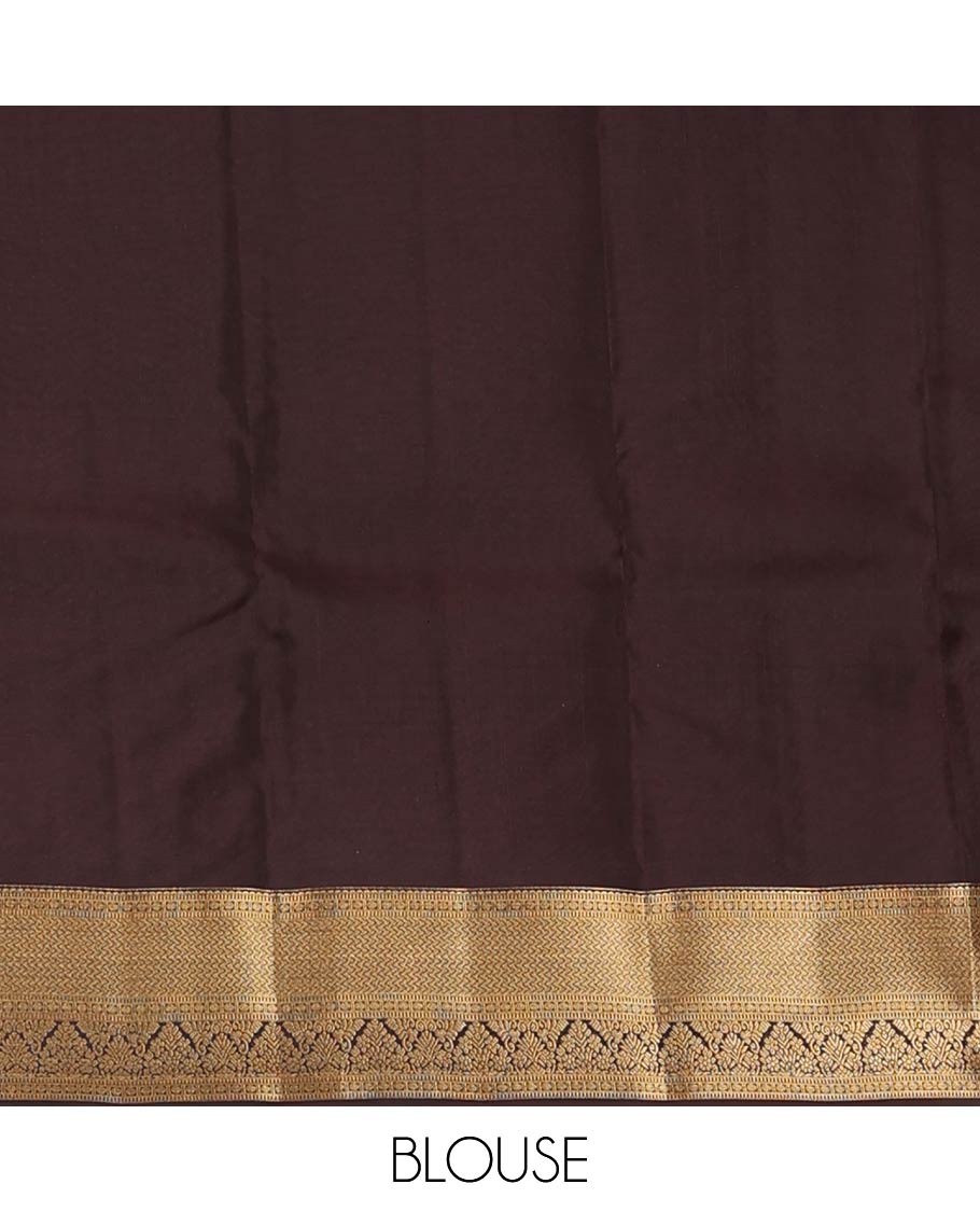 Green zari buttas Vasundhara silk mix saree, contrast border of rekku, muthu, poun, vanki, and zari designs, and leaf vine design pallu