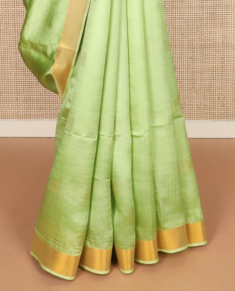 Leaf green buttas banana pith saree, zari border, and zari striped pallu