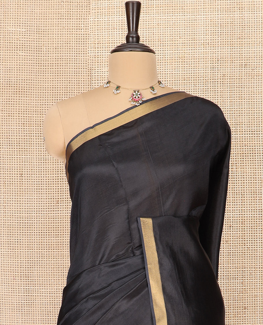 Black Plain Banana Pith Saree Subtly Sparkled with Zari Bavanji Border, Gleaming Zari Stripes Woven Pallu, and Paired with a Matching Plain Blouse