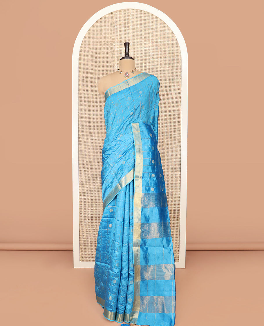 Blue Banana Pith Saree Detailed with Polka Dot Buttas Enclosed Checks, Subtle Zari Border, Gleaming Zari Stripes Woven Pallu, and Paired with a Matching Plain Blouse
