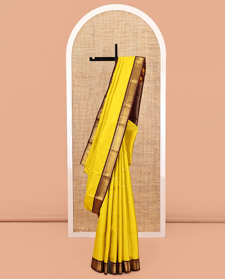 Yellow Vasundhara Silk Saree, Woven with Zari Buttas All Over Its Body, Complemented by a Contrast Korvai Border of Thilakam, Banaras, Neli, and Mayil Kann Designs, Grand Pallu, and Paired with a Contrast Blouse