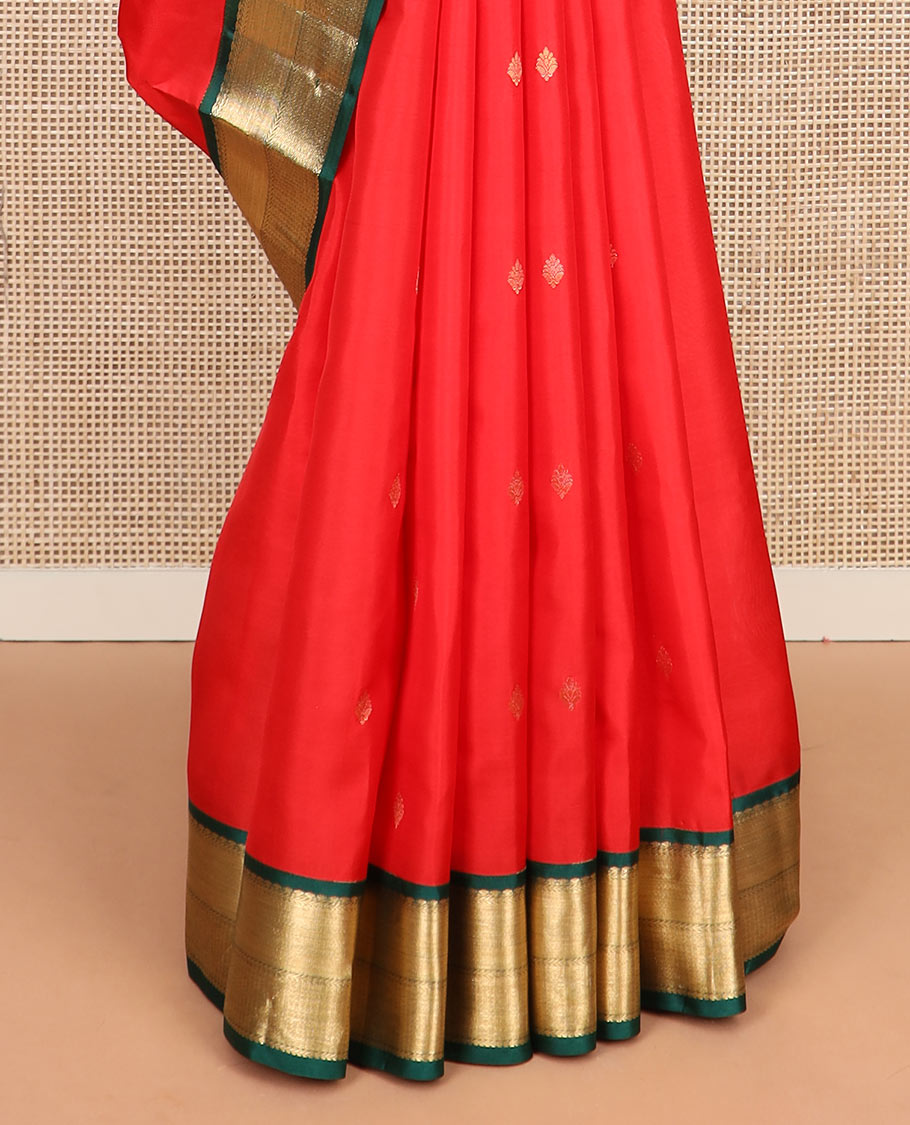 Red zari buttas silk saree, contrast border of thilakam mokku, kathir, and mayil kann, and jaal pallu