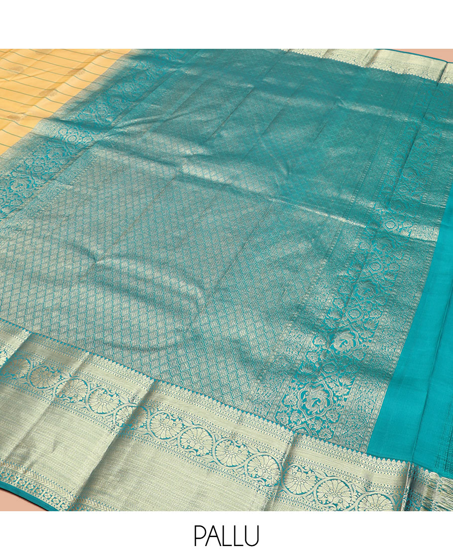 Yellow Vasundhara Silk Saree Graced with Stripes and Zari Buttas, Complemented by a Contrast Border of Thilakam Mokku, Vanki, Kathir, Lavangam, and Kodi Visiry Designs, Zari Elevated Pallu of Jaal Design, and Paired with a Contrast Blouse