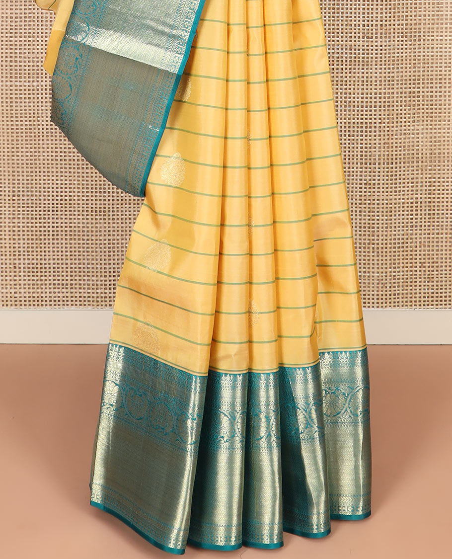 Yellow Vasundhara Silk Saree Graced with Stripes and Zari Buttas, Complemented by a Contrast Border of Thilakam Mokku, Vanki, Kathir, Lavangam, and Kodi Visiry Designs, Zari Elevated Pallu of Jaal Design, and Paired with a Contrast Blouse