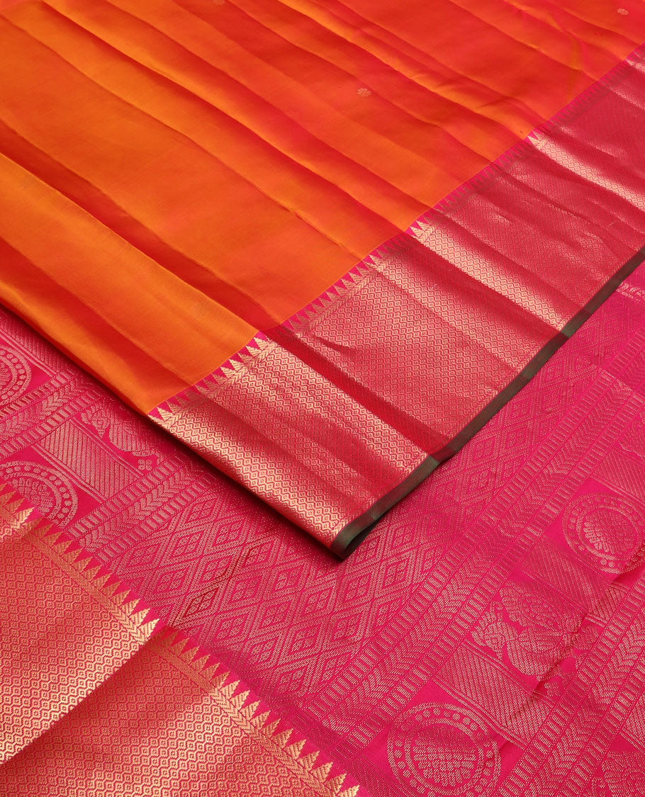 Orange zari buttas silk saree, contrast border of rekku & then kuli kann designs & pallu woven with Annam chakram & jaal design