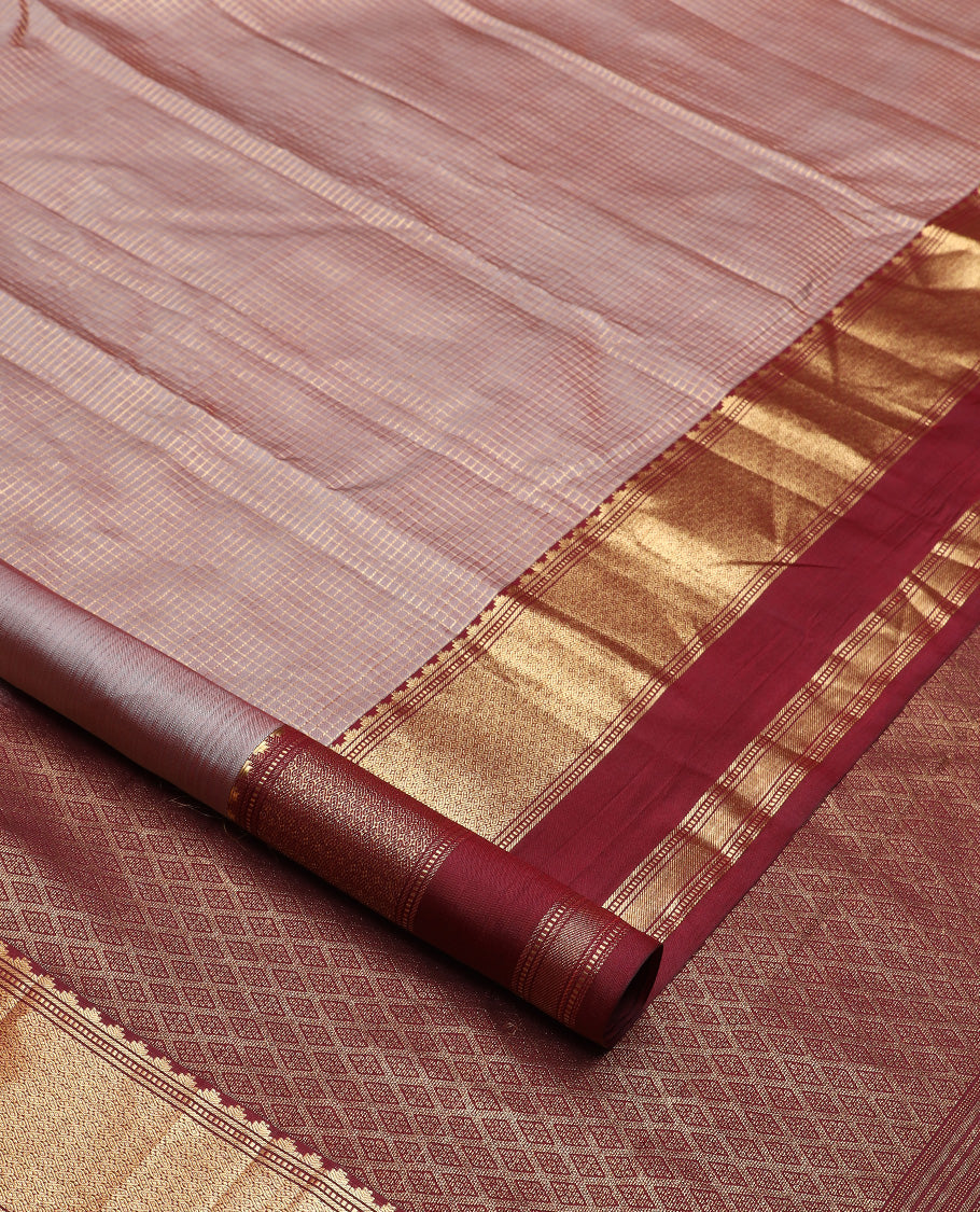 Brown micro-checked silk saree, contrast rettai pettu border of thazampoo rekku, banaras, muthu, and geometric designs, and jaal pallu