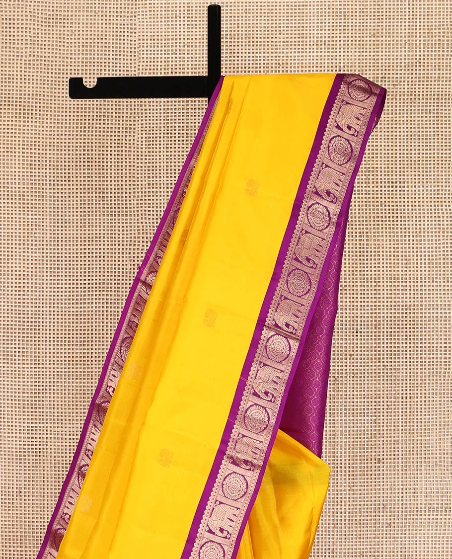 Yellow Vasundhara Silk Saree, Subtly Sparkled with Zari Buttas, Complemented by Contrast Border of Rekku, Chakram, and Yaanai Designs, Jaal Pallu, and a Contrast Blouse