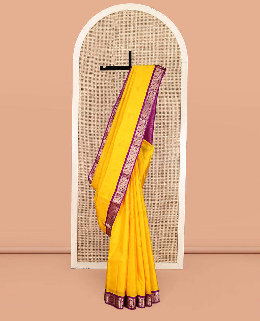 Yellow Vasundhara Silk Saree, Subtly Sparkled with Zari Buttas, Complemented by Contrast Border of Rekku, Chakram, and Yaanai Designs, Jaal Pallu, and a Contrast Blouse