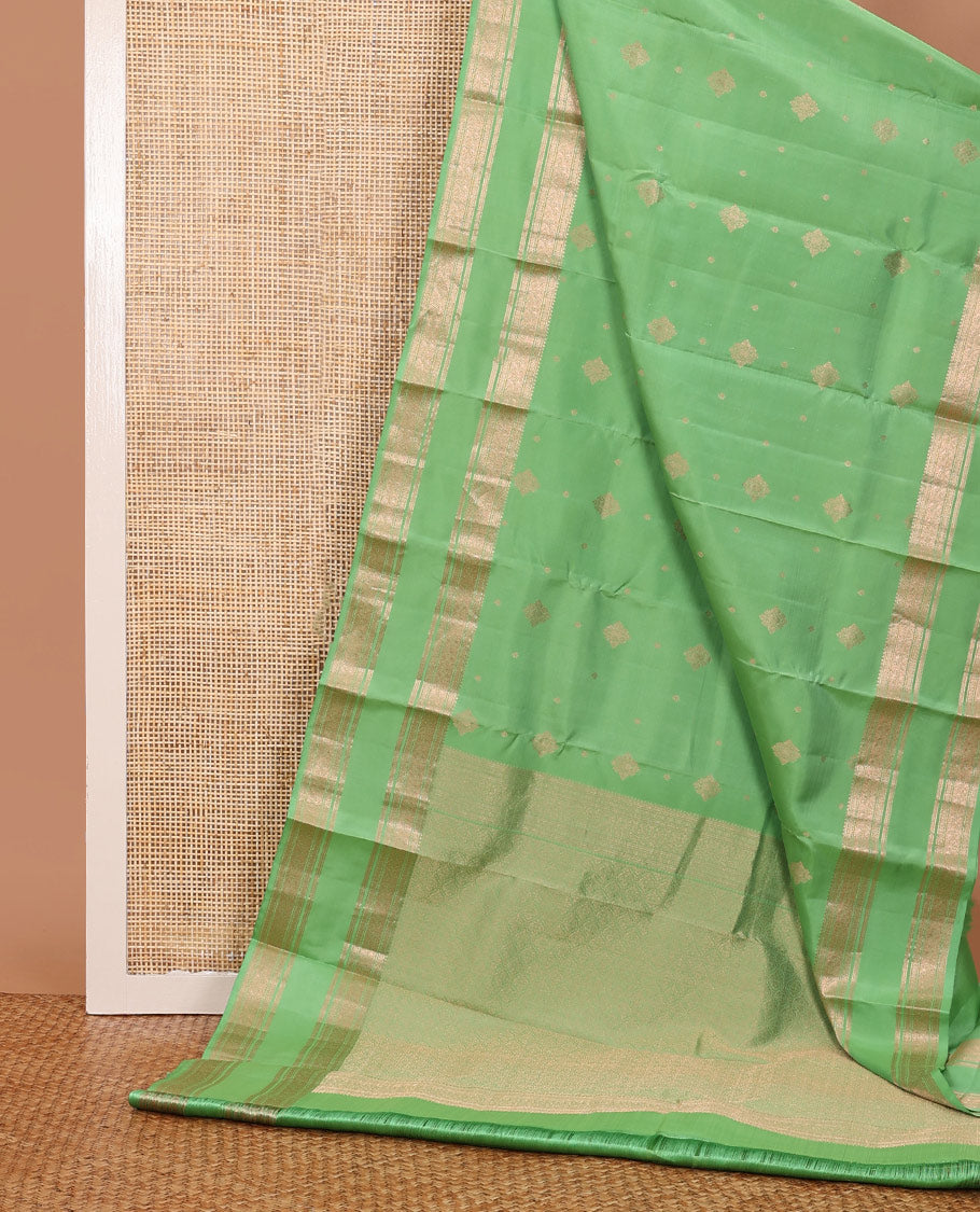 Pista green zari buttas silksaree, ogee patterned pallu & rettai pettu zari border of rekku,muthu,banaras & kili motifs