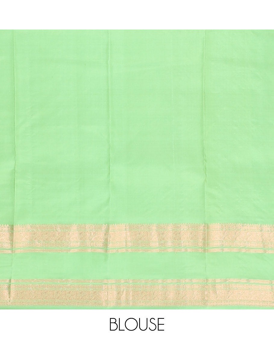 Pista green zari buttas silksaree, ogee patterned pallu & rettai pettu zari border of rekku,muthu,banaras & kili motifs