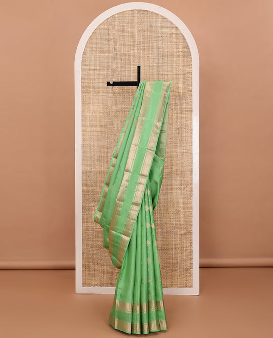 Pista green zari buttas silksaree, ogee patterned pallu & rettai pettu zari border of rekku,muthu,banaras & kili motifs