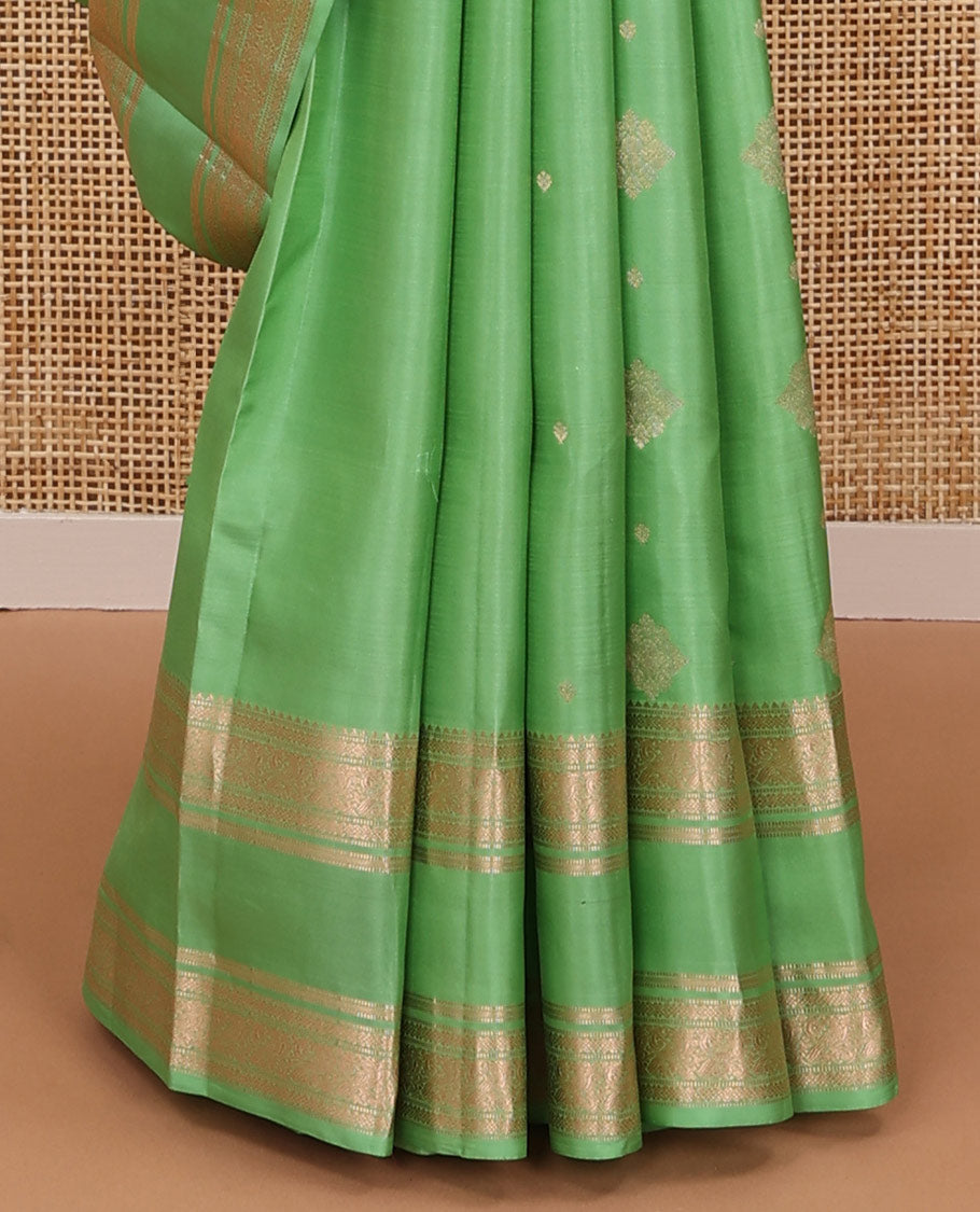 Pista green zari buttas silksaree, ogee patterned pallu & rettai pettu zari border of rekku,muthu,banaras & kili motifs