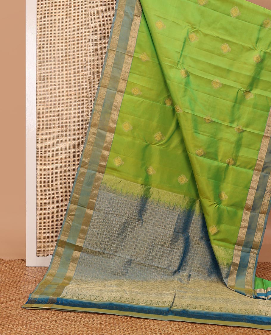 Green zari buttas silksaree, contrast rettai pettu border of rekku,kodi visiry & annam chakram & zari-rich jaal pallu