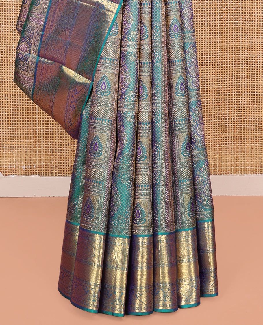 Blue Kanchipuram Wedding Silk Saree, Masterfully Woven with Jacquard Design on Its Body, Highlighted by a Zari Border of Thilakam, Chakram, Diamond, and Mayil Designs, Majestically Detailed Pallu, and Paired with a Matching Blouse