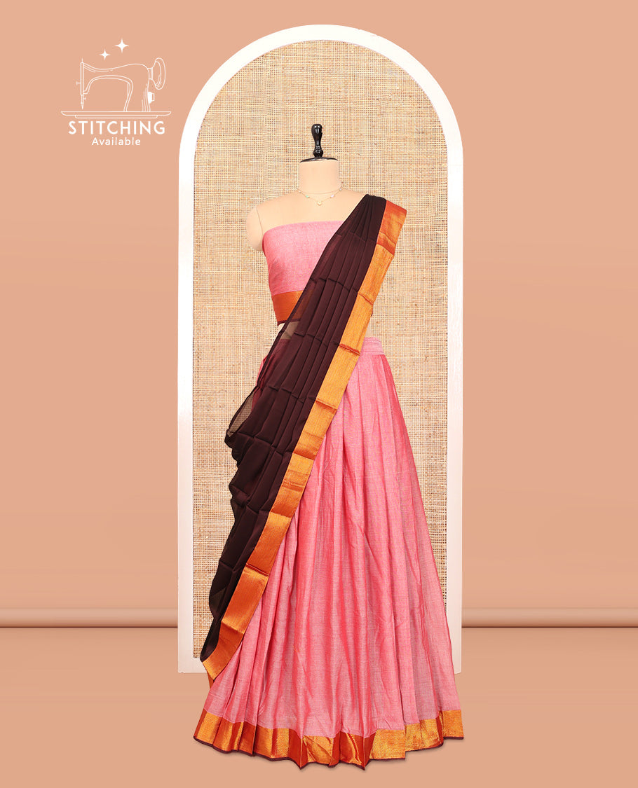 Pink Cotton Half-Saree Features Plain Skirt, a Contrast Zari Border, a Matching Blouse, and a Contrast Dhavani