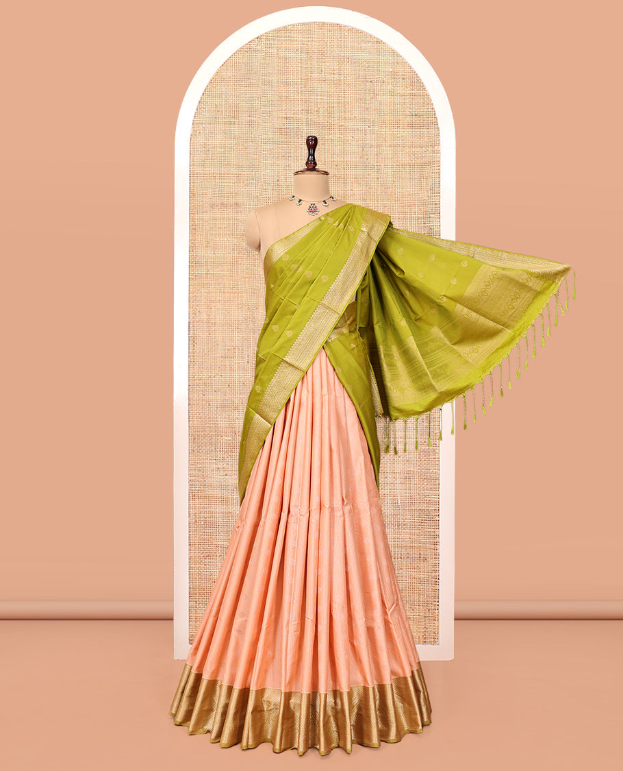 Peach Art Silk Half-Saree Pavadai Material Sparsely Woven with Zari-Buttas Skirt, a Contrast Traditional Border, Contrast Blouse, and Intricate Dhavani