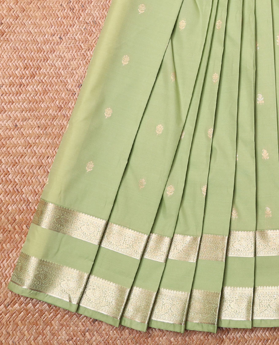 Pista Green Budget Silk Saree, Bedecked with Zari Buttas All Over Its Body, Highlighted by Traditional Zari Design Border of Peacock Designs, Gleaming Pallu of Jaal Designs, and Paired with a Matching Blouse