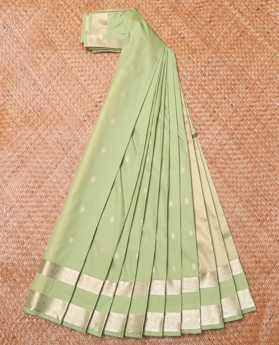 Pista Green Budget Silk Saree, Bedecked with Zari Buttas All Over Its Body, Highlighted by Traditional Zari Design Border of Peacock Designs, Gleaming Pallu of Jaal Designs, and Paired with a Matching Blouse